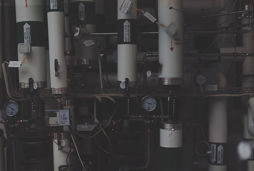 Industrial piping system with pressure gauges and control valves