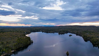 Aerial View of Serene Lake Surrounded by Forest at Dusk
