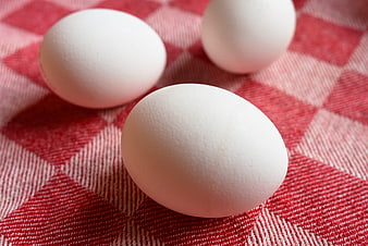 Three Fresh White Eggs On Red Checkered Kitchen Cloth