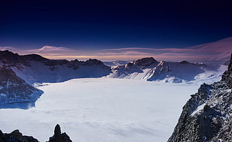 Snow-covered crater lake of Changbai Mountain at twilight