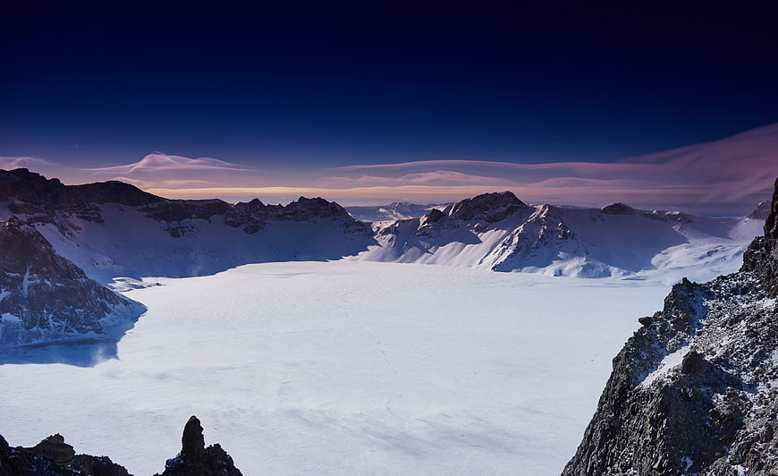 Snow-covered crater lake of Changbai Mountain at twilight