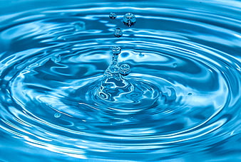 Blue Water Droplet Splash Ripples Close Up