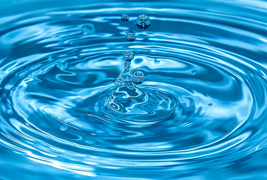 Blue Water Droplet Splash Ripples Close Up