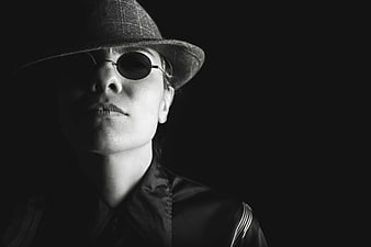 Dramatic Black and White Portrait of Man in Fedora and Sunglasses
