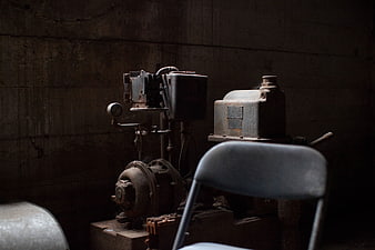 Dark moody industrial machinery in abandoned basement