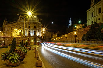 Nighttime Cityscape with Long Exposure Traffic Trails and Historic Architecture