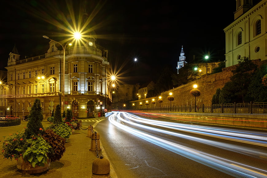 Nighttime Cityscape with Long Exposure Traffic Trails and Historic Architecture