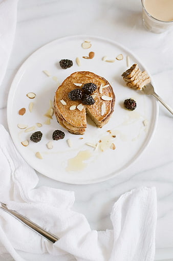 Overhead view of French toast with blackberries and almonds