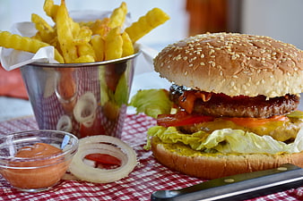 Delicious Cheeseburger with Crispy Fries on Red Checkered Tablecloth
