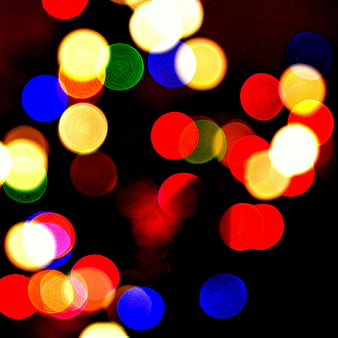 Abstract colorful bokeh lights on black background