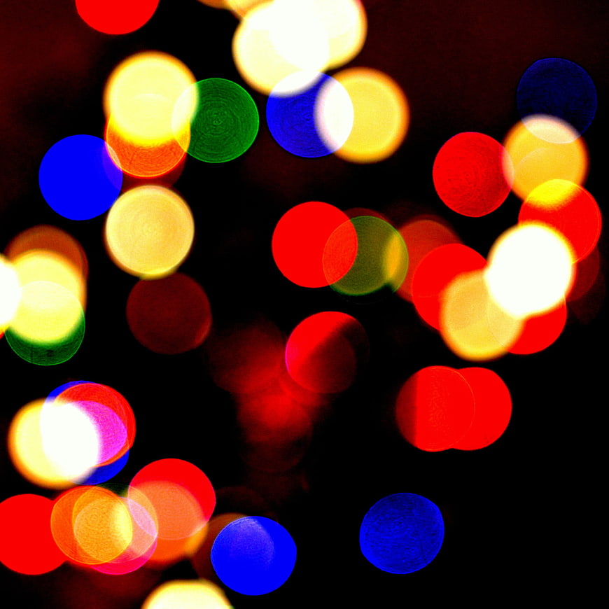 Abstract colorful bokeh lights on black background