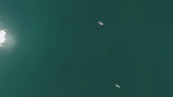 Aerial View of Two Small Boats on Calm Teal Water