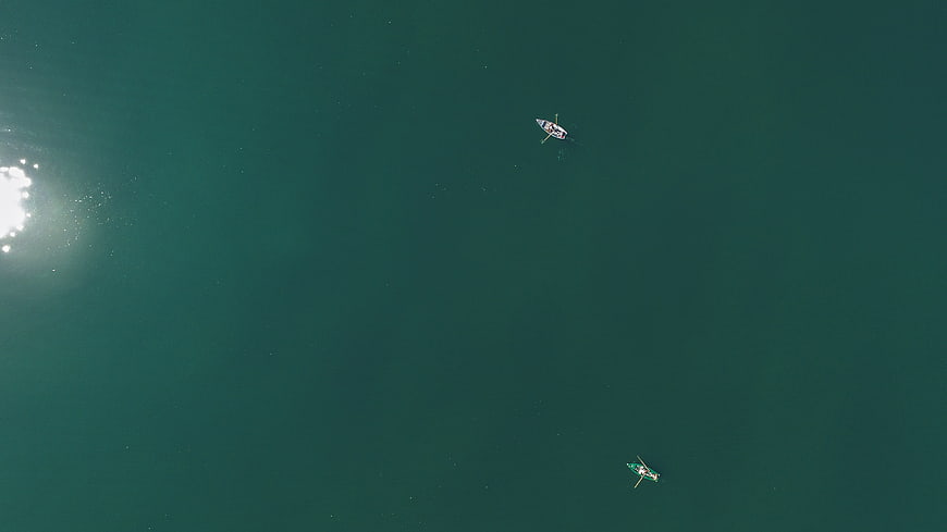 Aerial View of Two Small Boats on Calm Teal Water