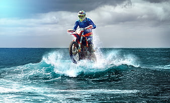 Motocross Rider Jumping Over Ocean Wave