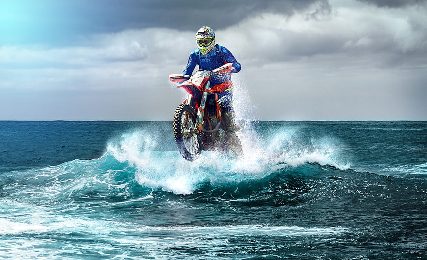 Motocross Rider Jumping Over Ocean Wave