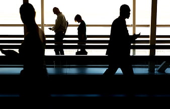 Silhouettes of Business People Walking in Airport Terminal