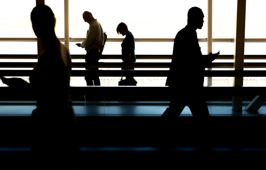 Silhouettes of Business People Walking in Airport Terminal