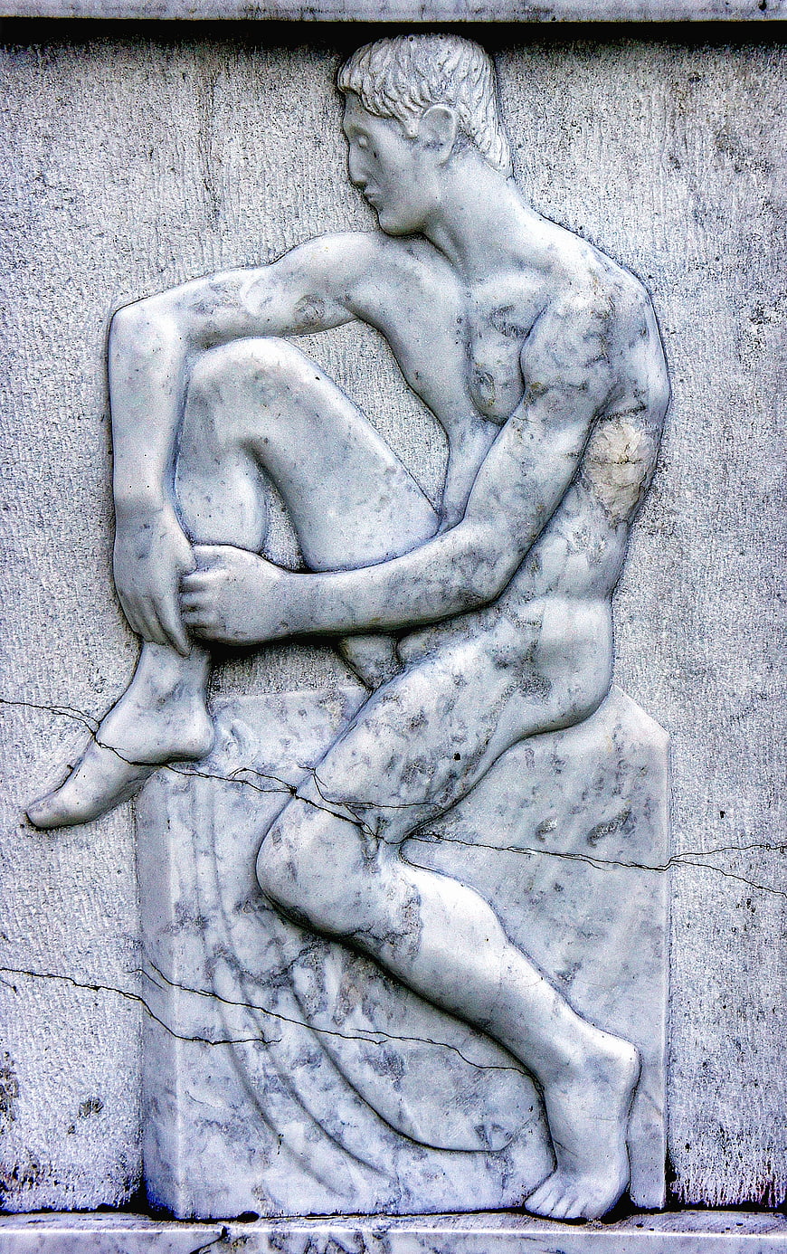 Weathered Marble Relief Sculpture of Seated Male Figure