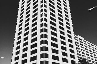 Black and white low angle view of modern high-rise building