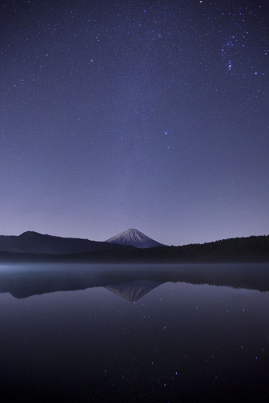 Starry Night Sky Over Mount Fuji Reflected in Lake