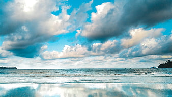 Dramatic Seascape with Cloud Reflections on Wet Beach