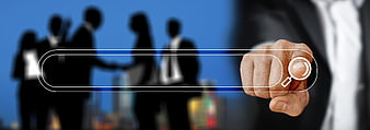 Businessman Hand Touching Magnifying Glass Icon on Digital Interface