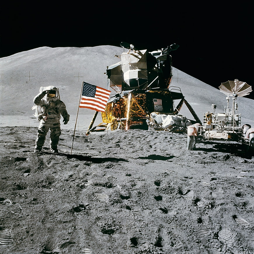 Astronaut saluting on the moon surface near lunar module