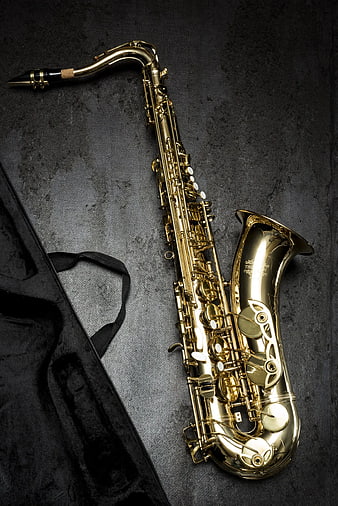 Gold Tenor Saxophone on Dark Textured Background