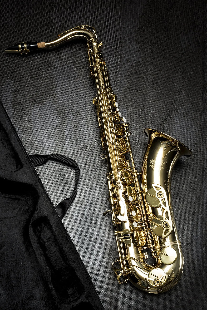 Gold Tenor Saxophone on Dark Textured Background