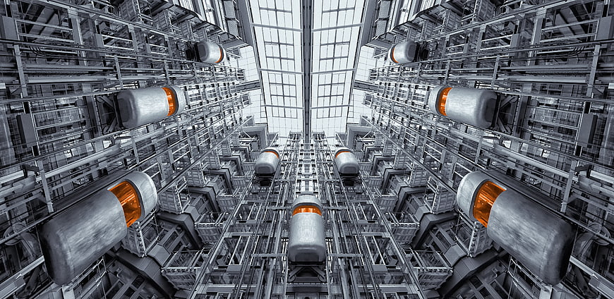 Futuristic elevator shaft interior with orange accents