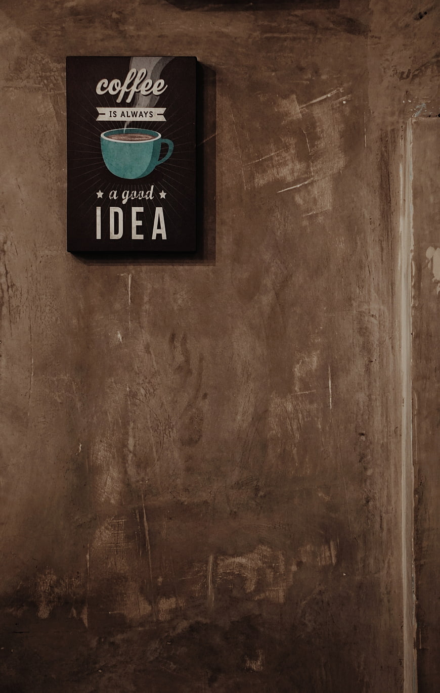 Coffee Quote Poster on Textured Concrete Wall