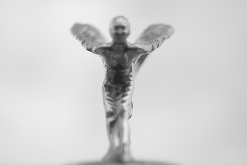 Blurred Black and White Flying Lady Statue