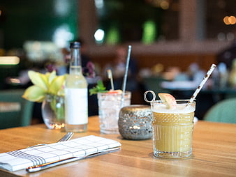Refreshing Apple Cocktail and Wine on Wooden Restaurant Table