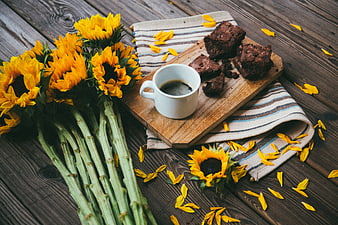Sunflowers, Brownies, and Coffee on Rustic Wooden Table