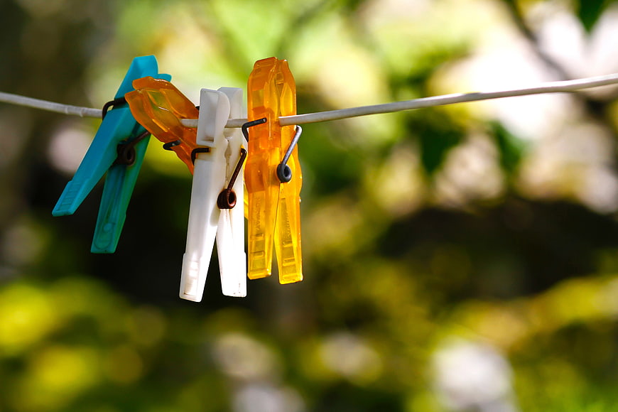 Colorful Plastic Clothespins on a Clothesline