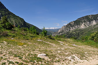 Scenic Mountain Valley Landscape with Snow-Capped Peaks