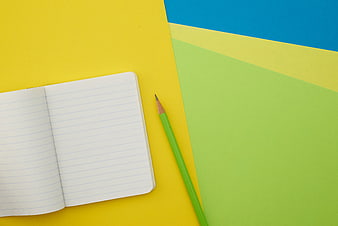 Colorful Flat Lay of Notebook and Pencil on Bright Background