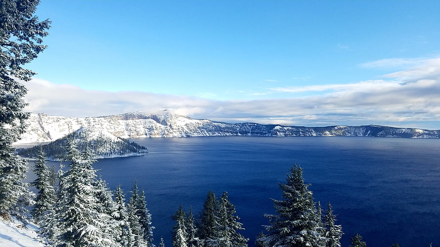 Snowy Crater Lake Winter Landscape with Pine Trees