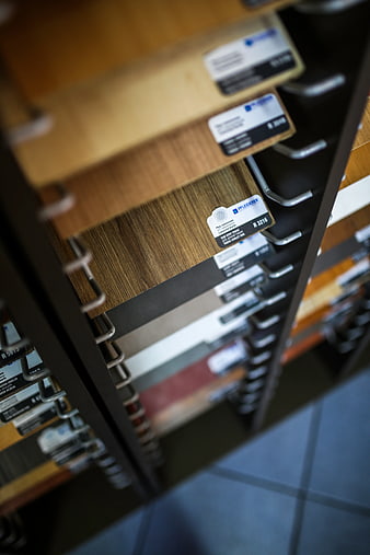 Wood laminate flooring samples in a retail display rack