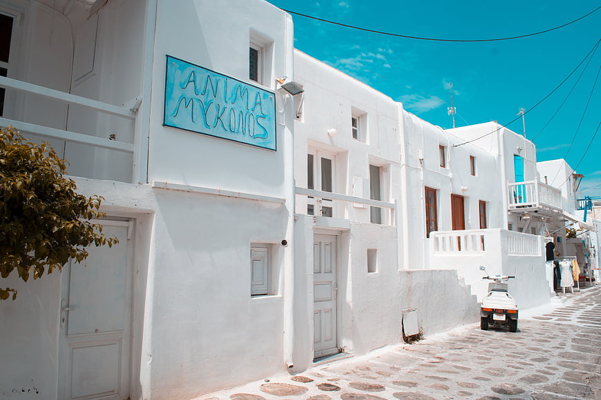 White Cycladic Architecture and Cobblestone Street in Mykonos, Greece