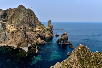 Dokdo Island Coastal Landscape With Sea Stacks And Clear Blue Water