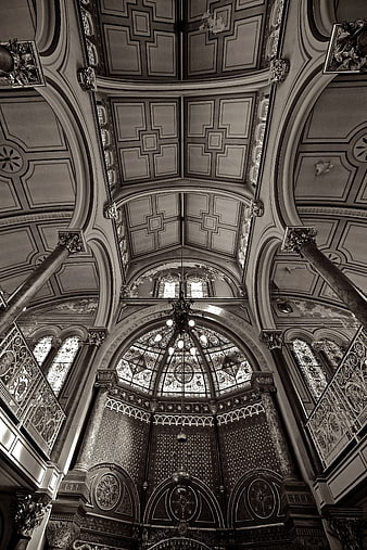 Black and white interior of ornate synagogue ceiling