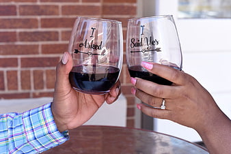 Couple toasting with I Asked I Said Yes wine glasses