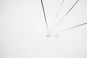Minimalist Ski Lift Chairs in Heavy Fog