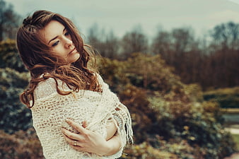 Portrait of Young Woman in White Shawl Outdoors