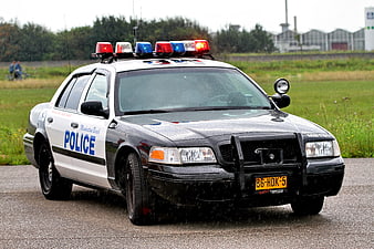 Classic Black and White Police Car with Active Light Bar