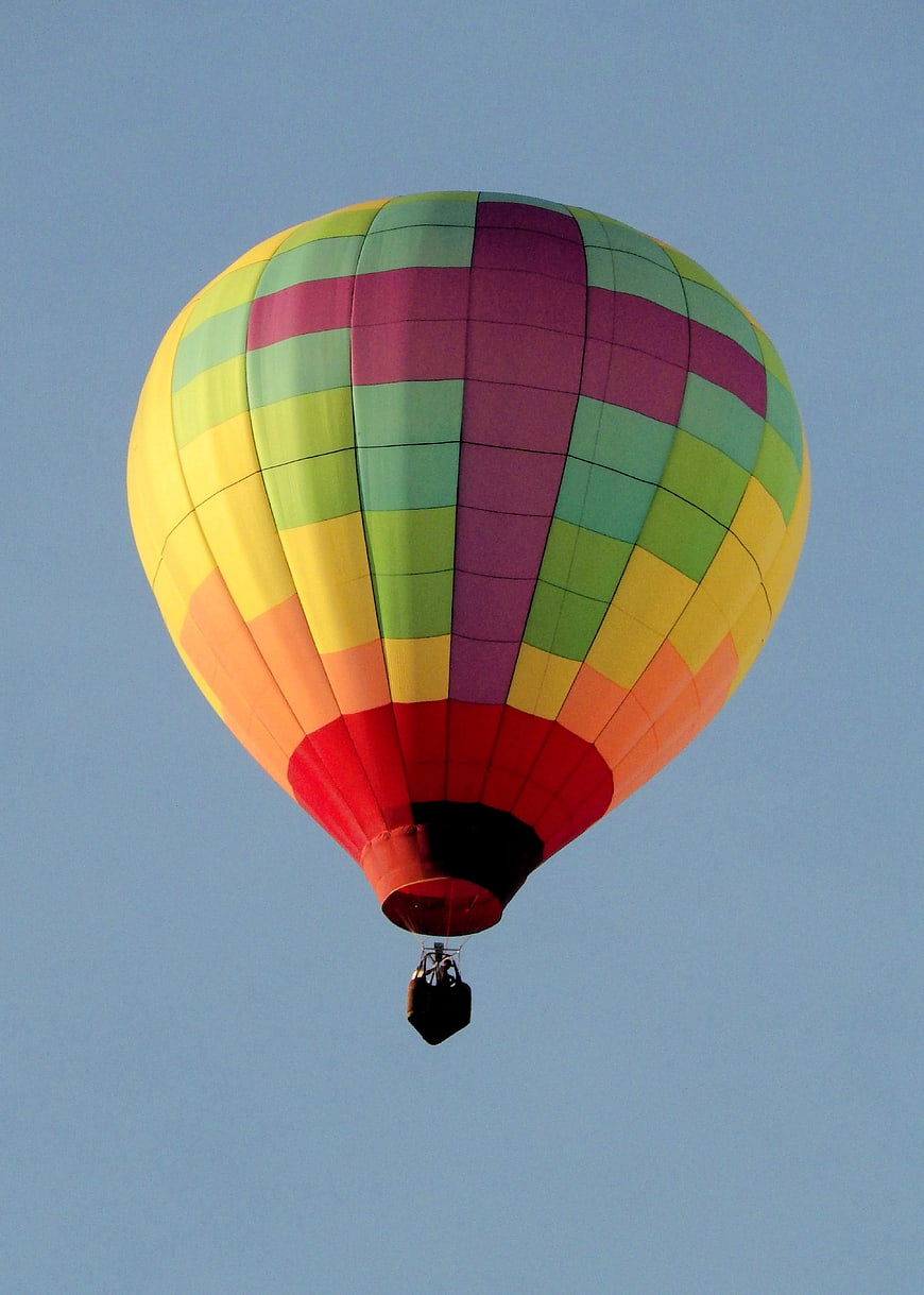 Colorful Hot Air Balloon Flying in Blue Sky