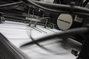 Close-up of Heidelberg printing press in motion