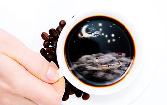 Surreal coffee cup with fantasy night sky scene inside