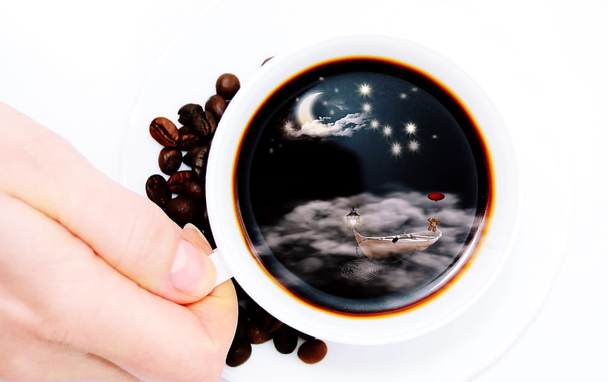 Surreal coffee cup with fantasy night sky scene inside